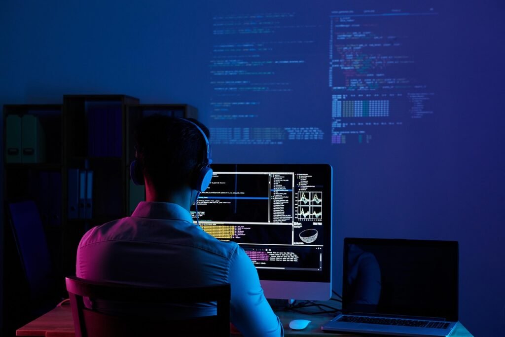 Developer working on laptop building an AI powered app to make money