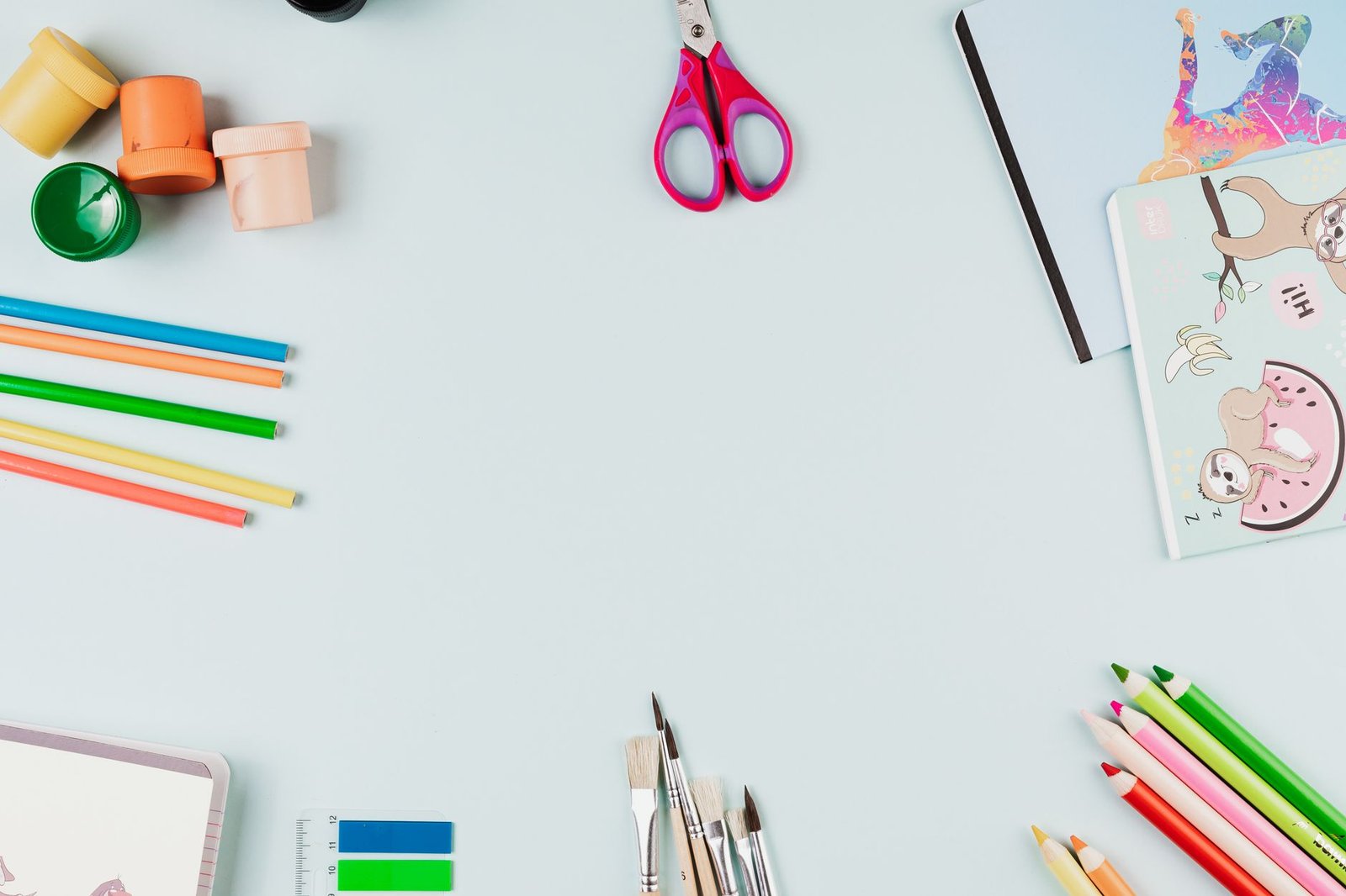 Flat lay of colorful art supplies, like a full design toolkit
