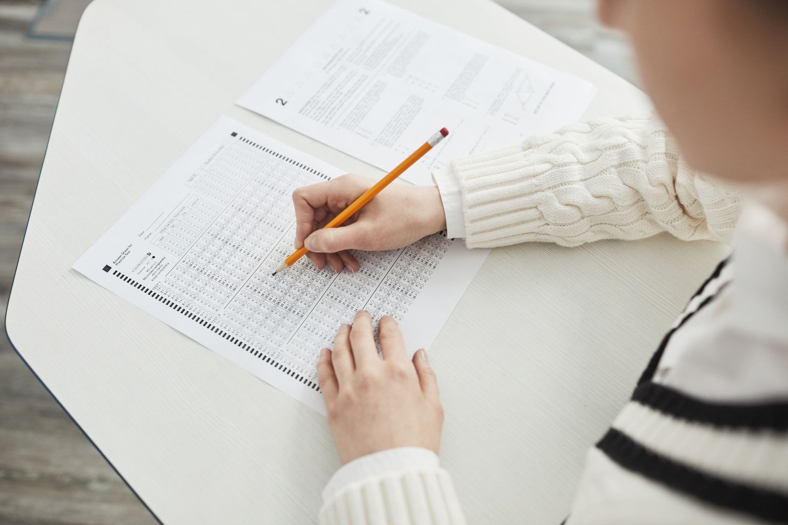 Student filling out a multiple-choice standardized test answer sheet