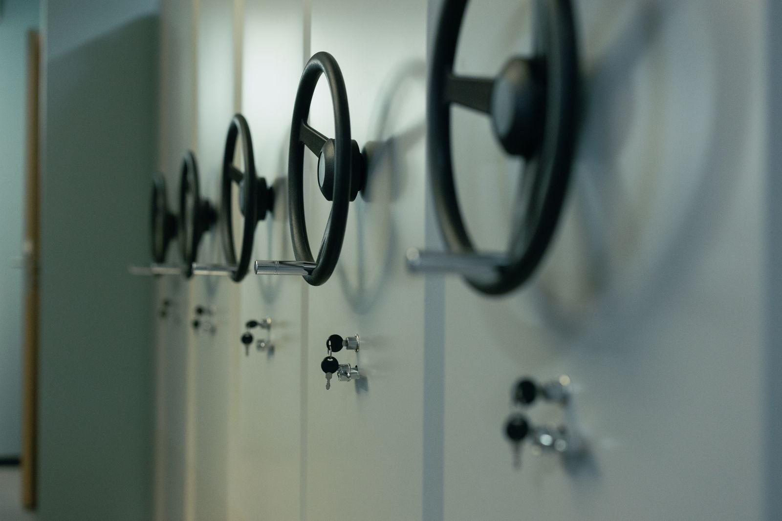 A row of school lockers fitted with combination dial locks