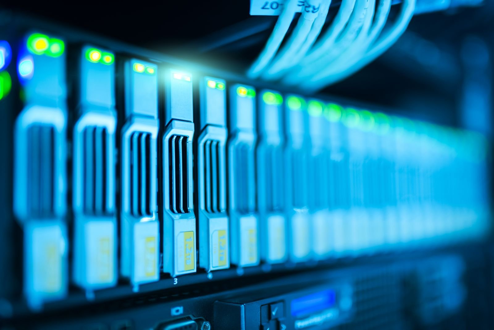 A server rack glowing in a data center, the place where most of the world's new memory chips are going