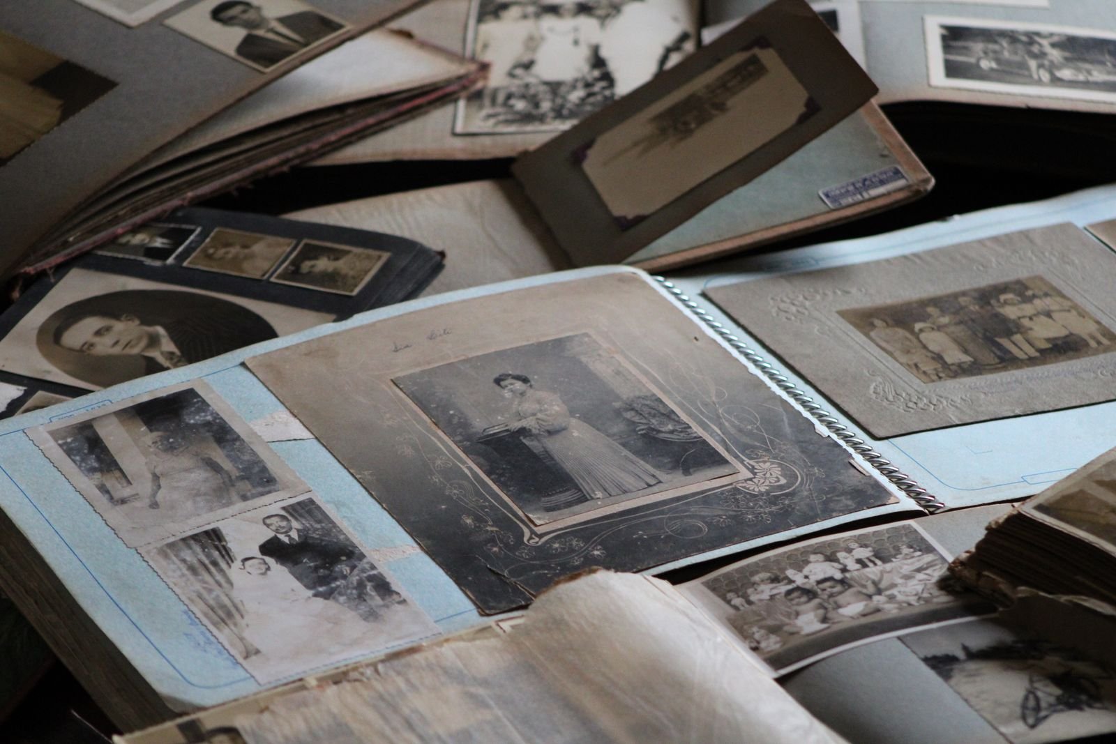 Open family photo albums on a table, the job Gemini Spark Google Photos automates
