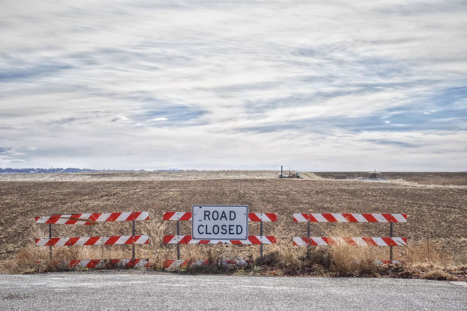 A road closed sign blocking a lane, standing in for an AI task that cannot be finished or abandoned